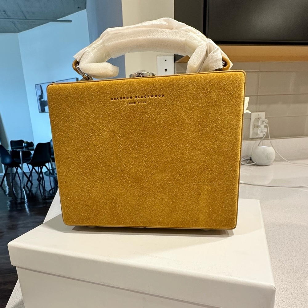 Brandon Blackwood Kendrick trunk yellow suede